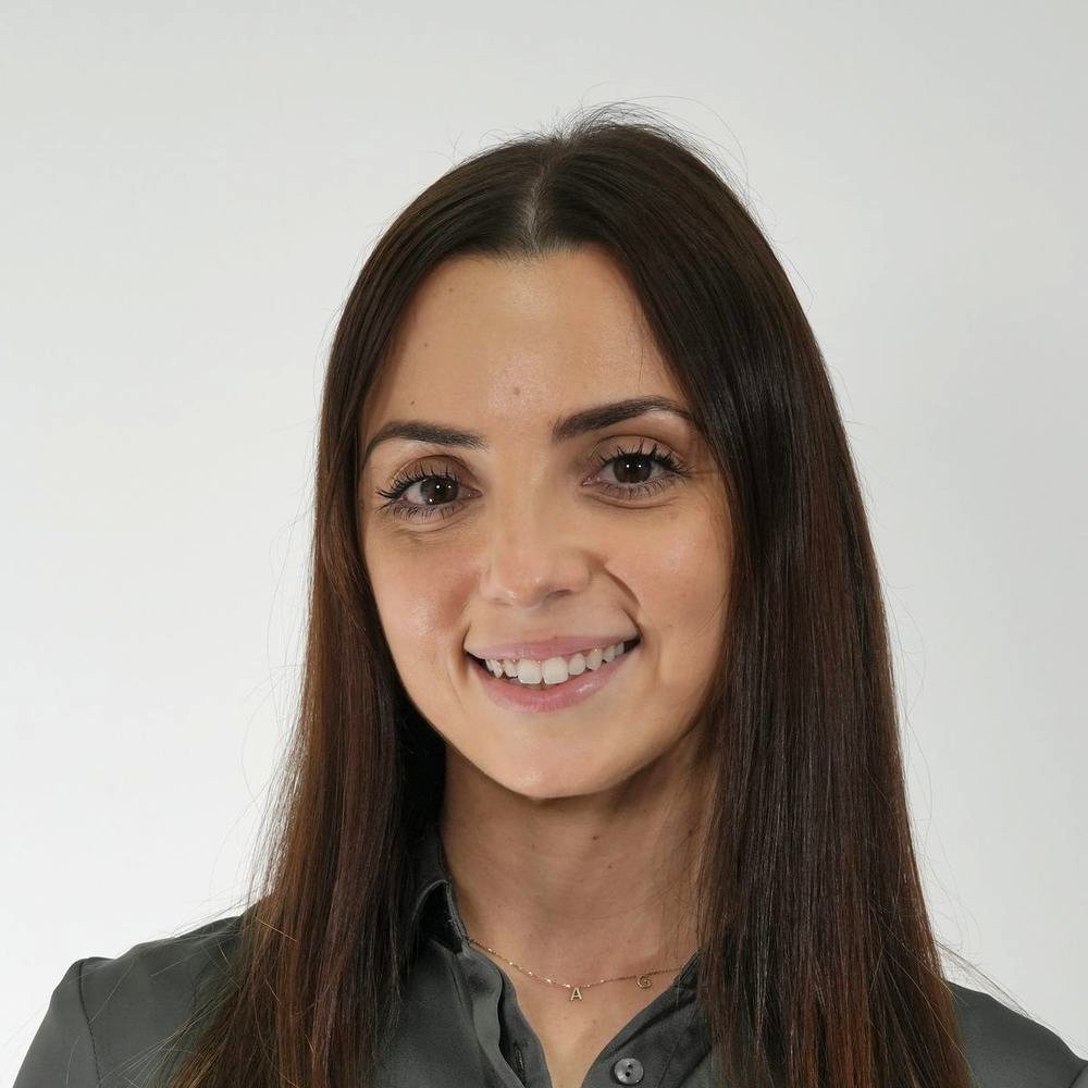 Law firm team headshot on grey