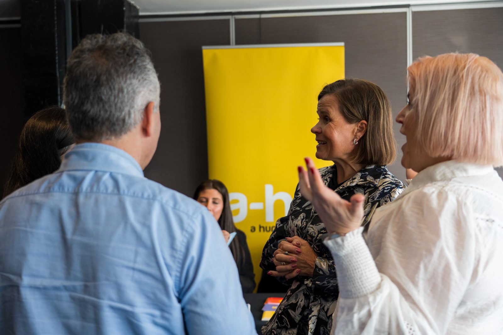 Panel discussion on stage at a Sydney business conference