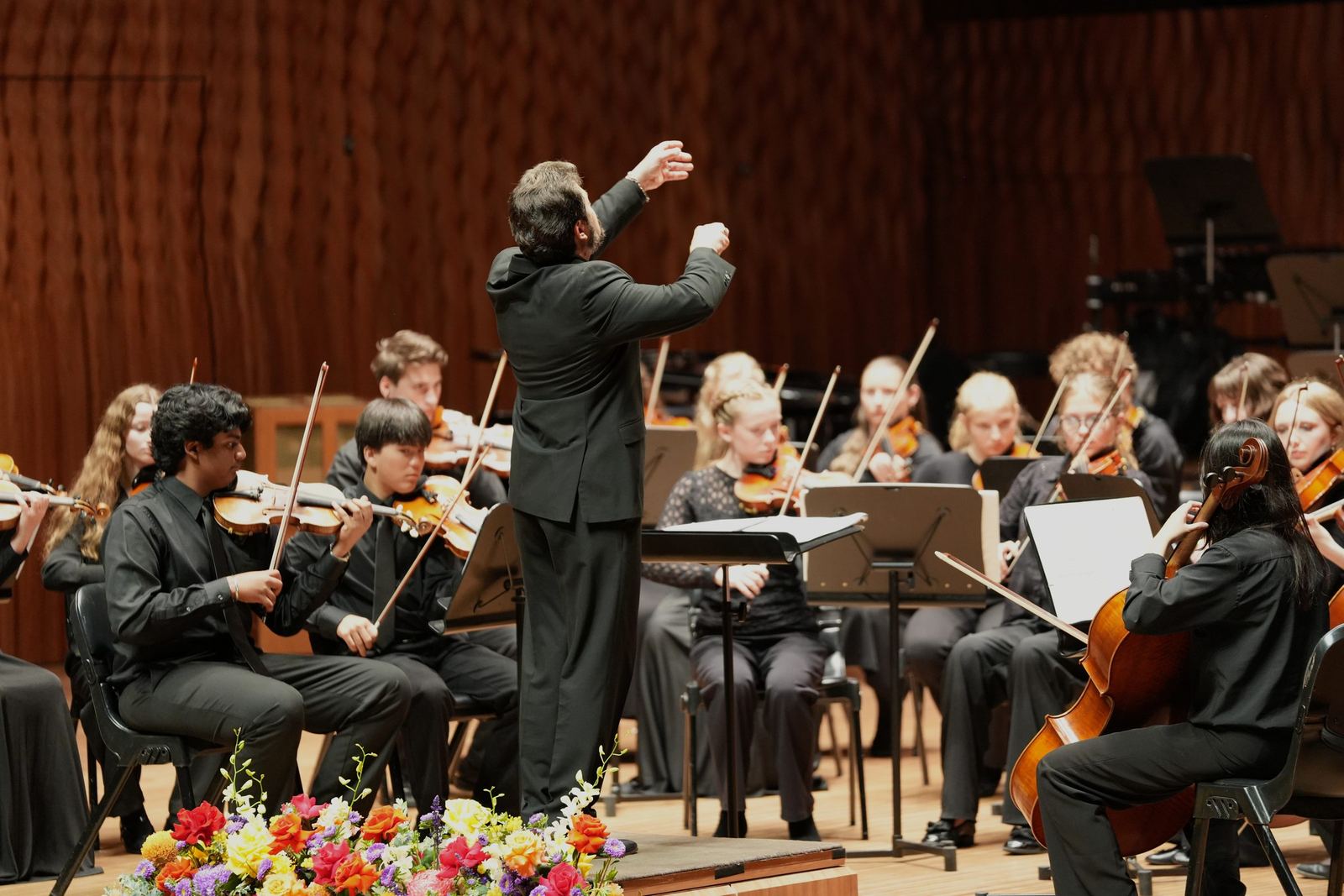 Conductor leading the strings in the Concert Hall